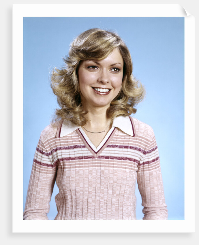 1970s Portrait Curly Woman Wearing Pink Stripe Sweater by Anonymous