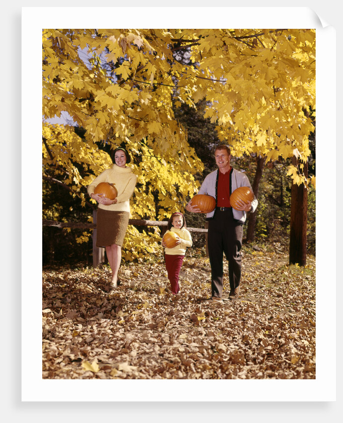 1960s Family Trio Father Mother Daughter Walking In Autumn Woods Carrying Pumpkins by Anonymous