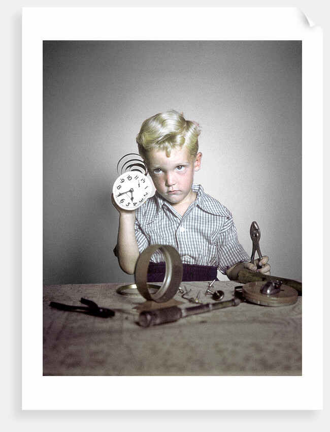 1950s Funny Curious Little Boy Holding Pliers Tool Taking Apart An Alarm Clock by Anonymous