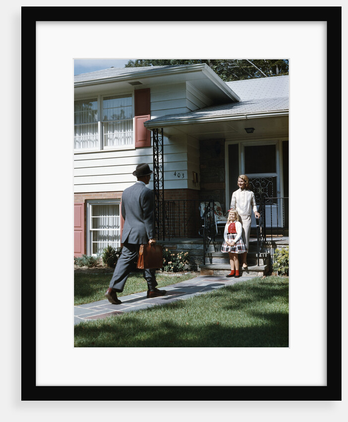 1950s Woman and Daughter Waiting At Front Steps For Man Coming Home by Anonymous