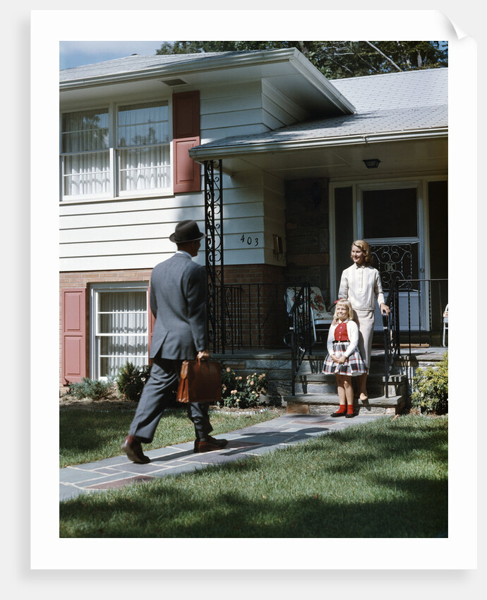 1950s Woman and Daughter Waiting At Front Steps For Man Coming Home by Anonymous