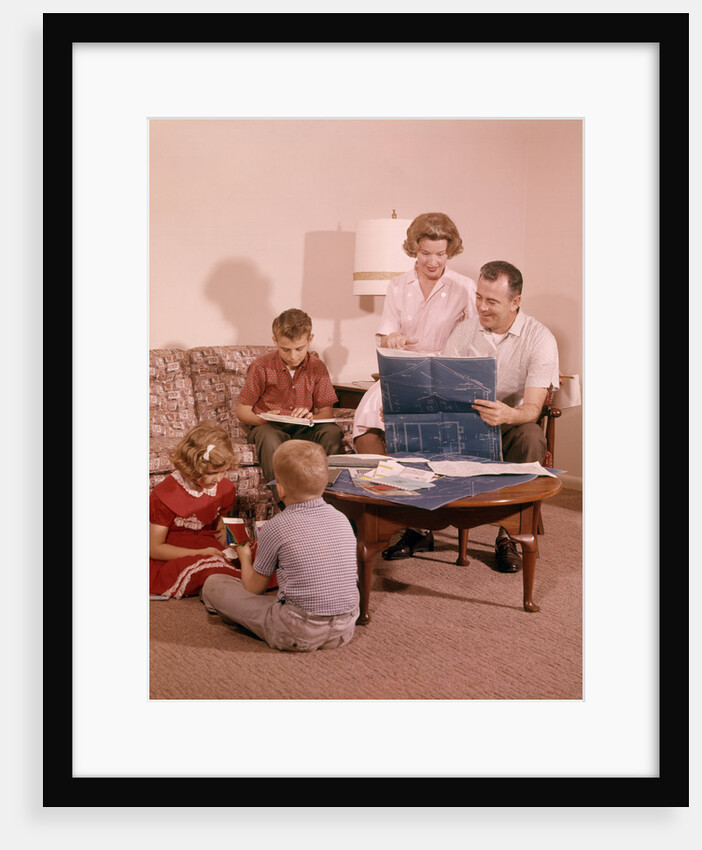 1960s Family In Living Room Looking At New House Blueprint Plans by Anonymous
