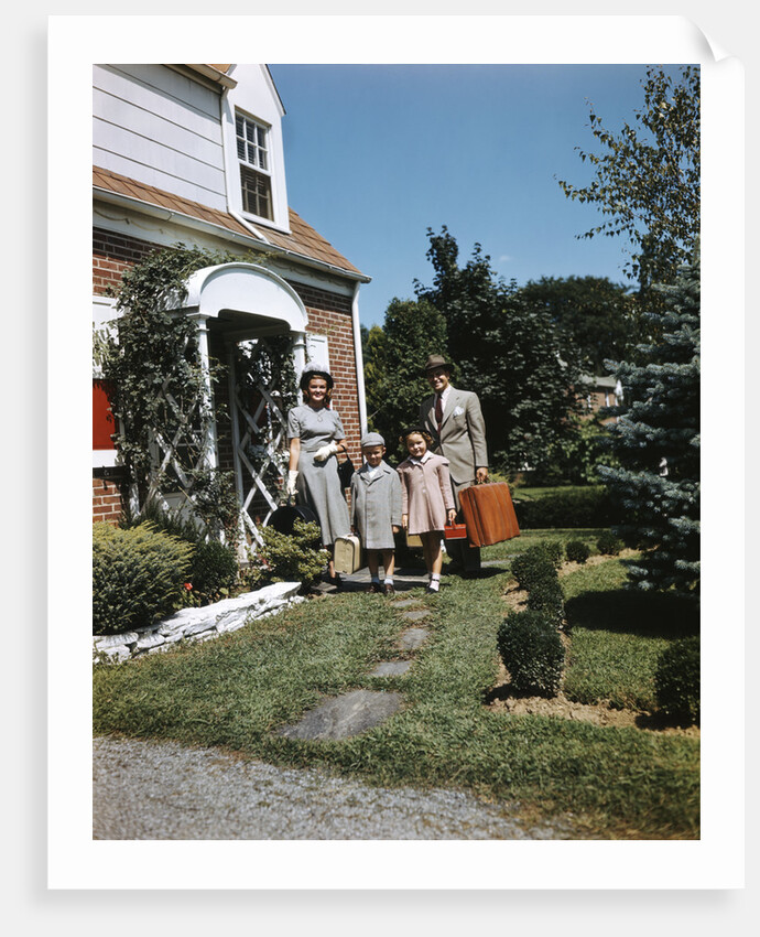 1940s 1950s Family Father Mother Daughter Son Leaving Suburban House Carrying Luggage by Anonymous