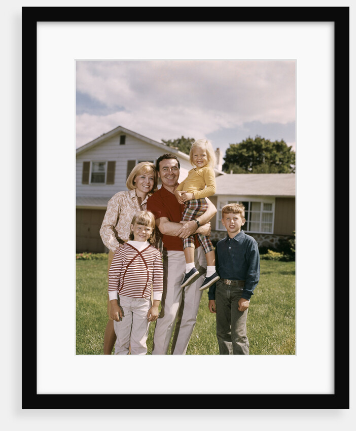 1960s Family In Front Of A Suburban Split Level House by Anonymous