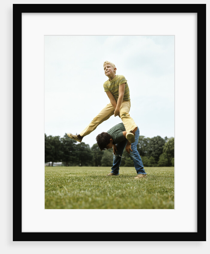 1970s Two Boys Jumping Playing Leapfrog by Anonymous