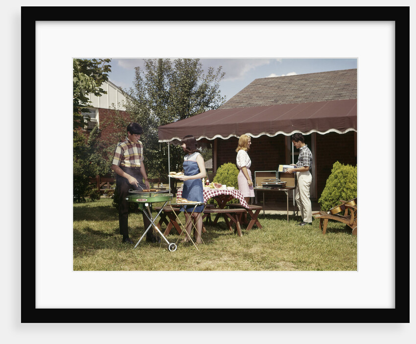 1960s Two Teenaged Couples Having Barbecue In Suburban Backyard by Anonymous