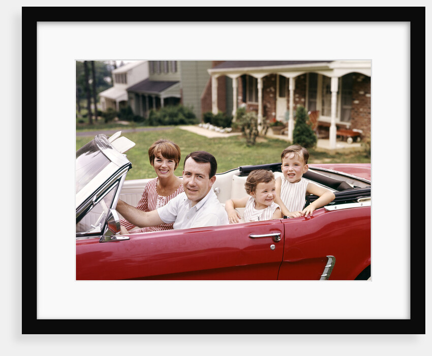 1960s Suburban Family Sitting In Red Ford Convertible Mustang by Anonymous