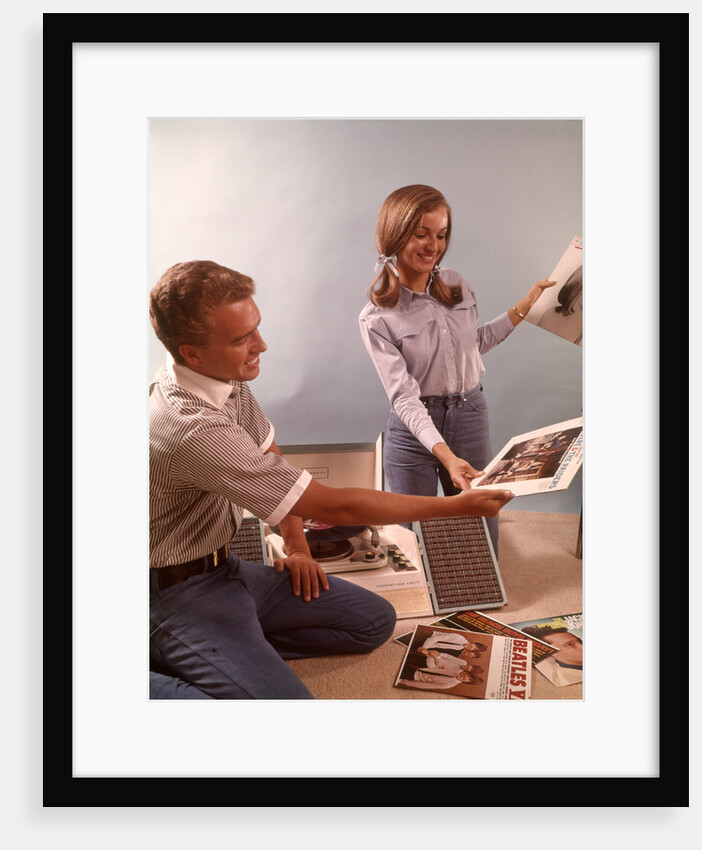 1960s Teenage Couple Boy Girl Sorting Listening To Vinyl Record Music Albums by Corbis