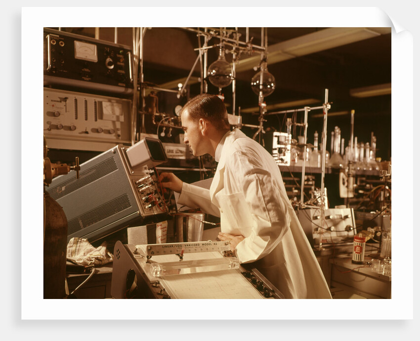 1960s Scientist Lab Technician Looking Into Oscilloscope In Laboratory by Anonymous