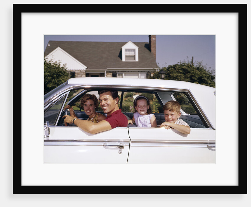 1960s Father And Mother With Son And Daughter Sitting In White Four Door Sedan Automobile by Anonymous