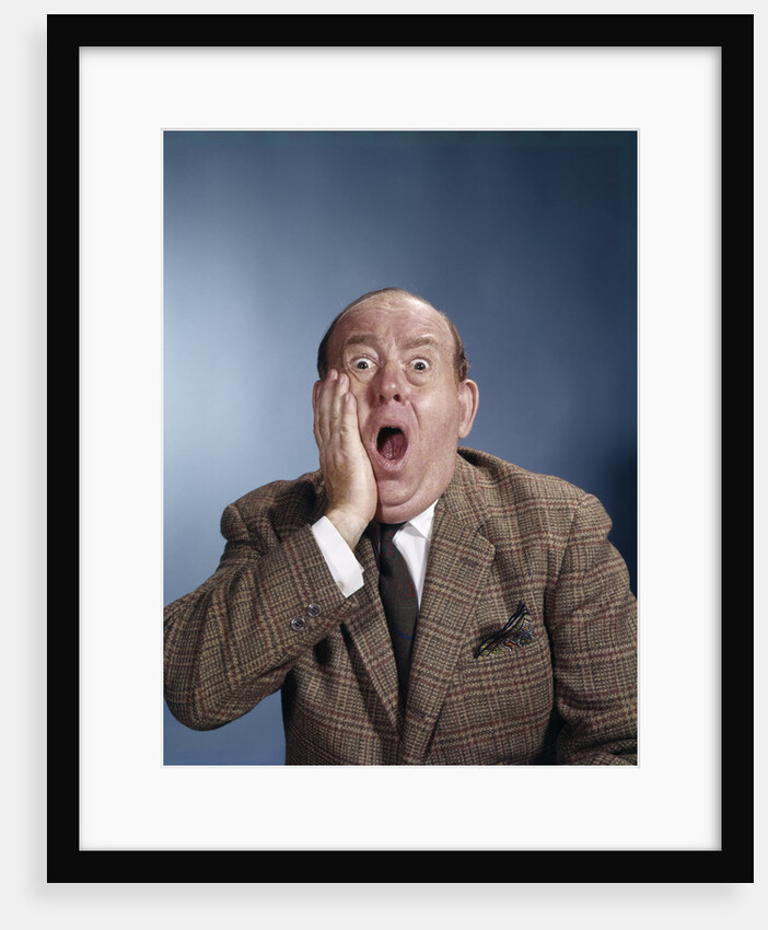 1960s Balding Businessman Holding Hand Up To Face Shocked Expression Eyes Bulging Mouth Open by Anonymous