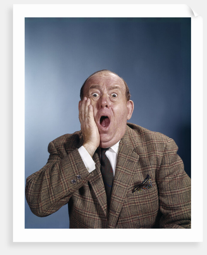 1960s Balding Businessman Holding Hand Up To Face Shocked Expression Eyes Bulging Mouth Open by Anonymous