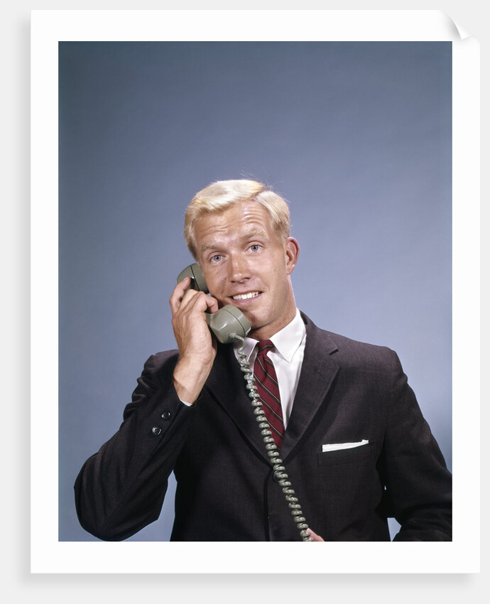 1960s Young Businessman Salesman Talking On Telephone by Anonymous