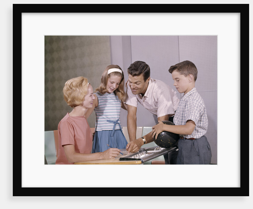 1960s Family Mother Father Daughter Son Together Bowling Looking At Score by Anonymous