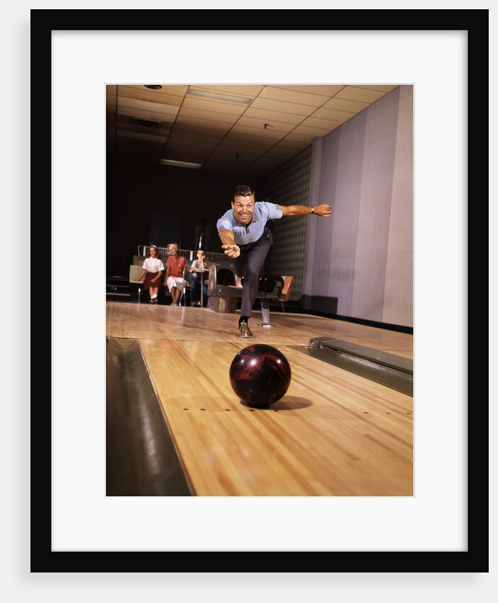1960s Man Throwing Bowling Ball Down Alley As Family Watches In Background Fun Dad Father by Anonymous