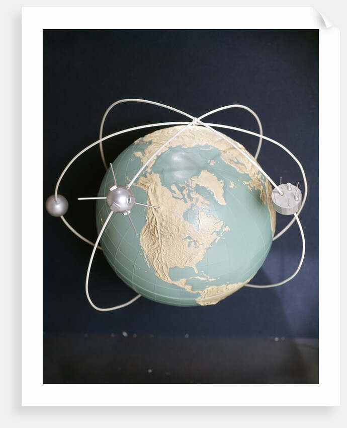 1950s 1960s Model Of Satellites Orbiting The Globe by Anonymous