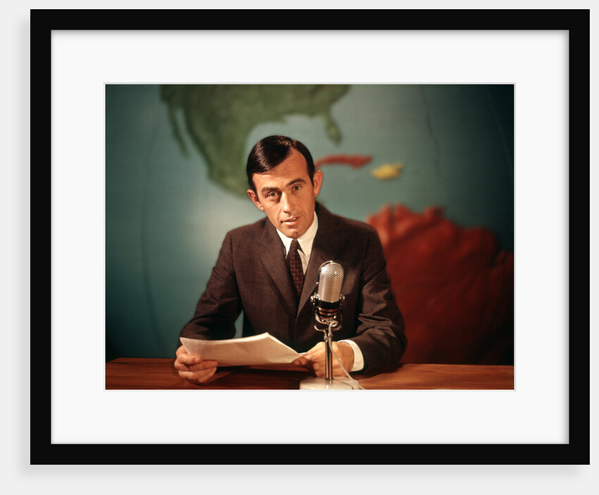 1960s Reporter Reading News Into Microphone With Global Map In Background by Anonymous