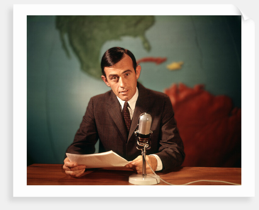 1960s Reporter Reading News Into Microphone With Global Map In Background by Anonymous