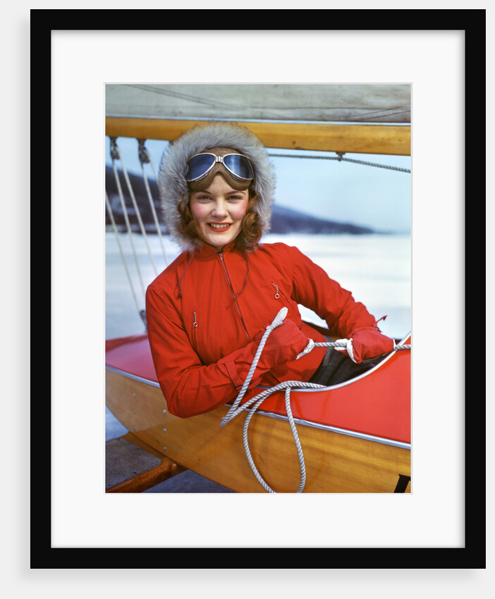 1940s Young Woman Sitting In Cockpit Of Ice Boat Holding Sheet Rope To Sail Boom by Anonymous
