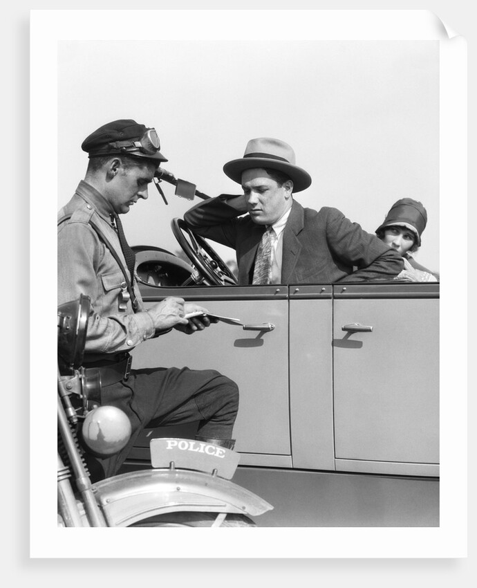 1920s Motorcycle Policeman Writing A Speeding Ticket To A Couple Sitting In Convertible Sedan by Anonymous