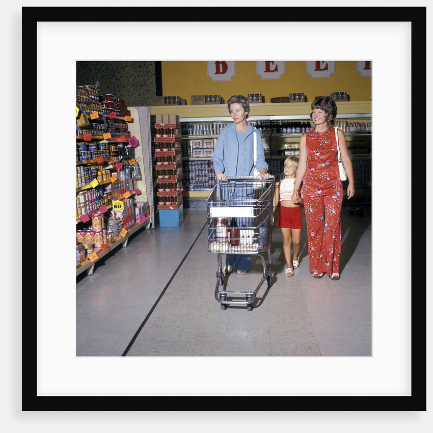 1970s Two Women Small Girl Walking Down Supermarket Grocery Store Aisle Woman Pushing Cart by Anonymous