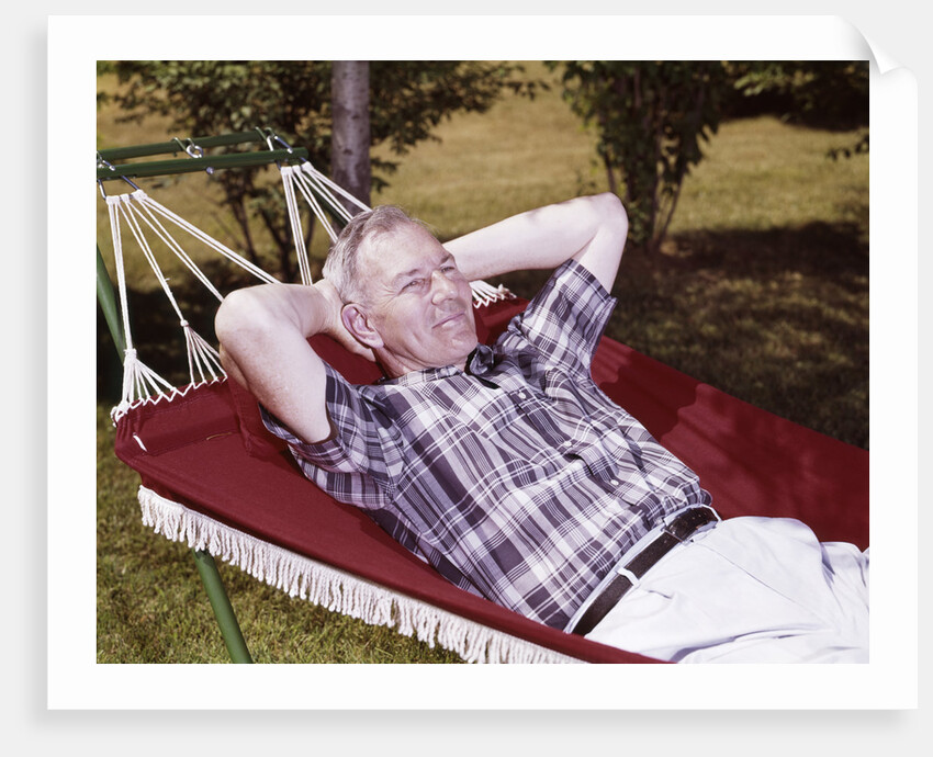 1960s Older Man Lying In Hammock In Backyard Retired Lifestyle Leisure by Anonymous