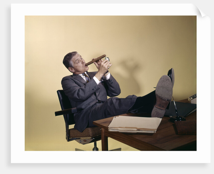 1960s Successful Businessman With Look Of Satisfaction Sitting With Shoes Propped On Desk by Anonymous