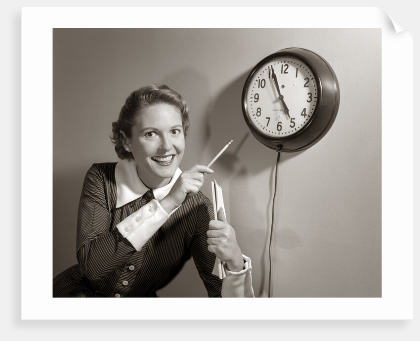 1950s Woman Holding Steno Pad Pointing With Pencil To Clock 5 Minutes Till Quitting Time by Anonymous