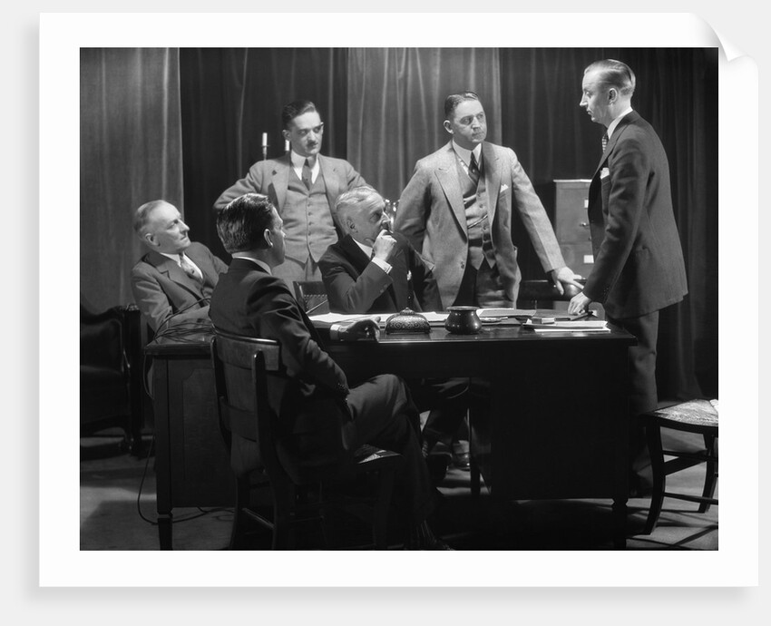 1930s Five Older Businessmen Meeting Around A Desk Listening To A Sixth Younger Man Speak by Anonymous