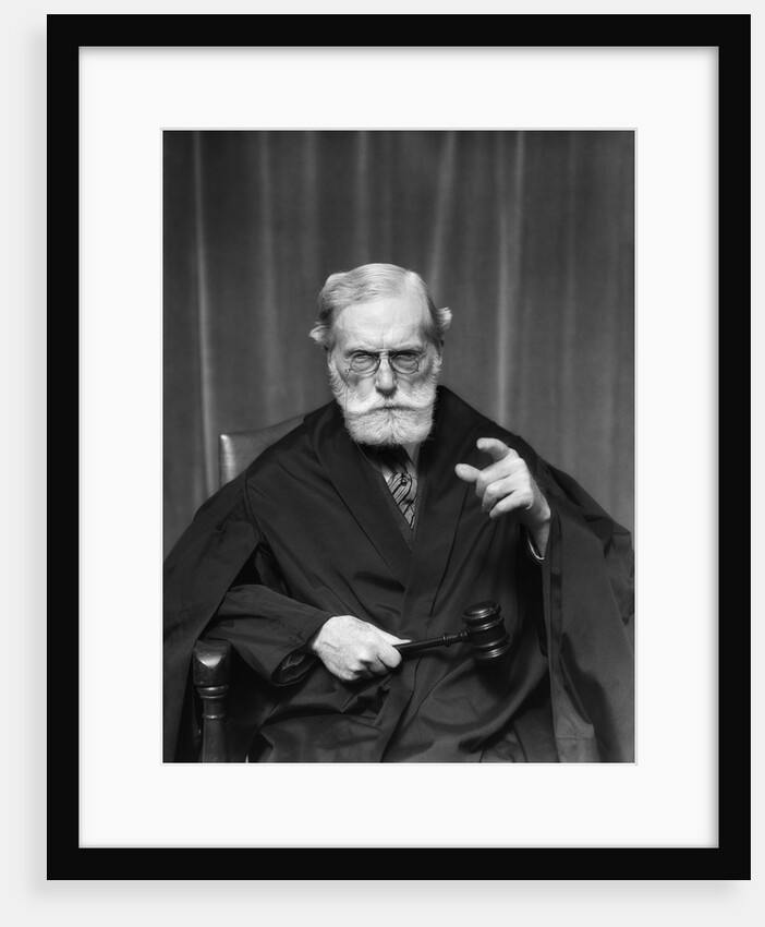 1930s Stern Elderly Judge With Beard And Glasses Pointing At Camera by Anonymous
