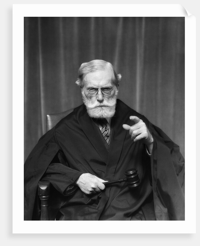 1930s Stern Elderly Judge With Beard And Glasses Pointing At Camera by Anonymous