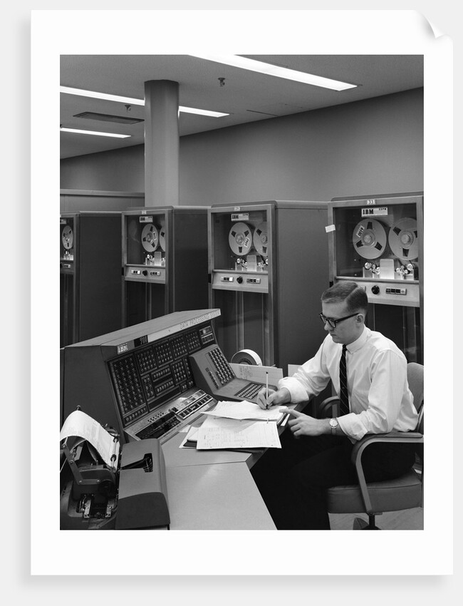 1960s Man In Shirt and Tie and Glasses At Control Console For Ibm Data Processing Systm by Anonymous