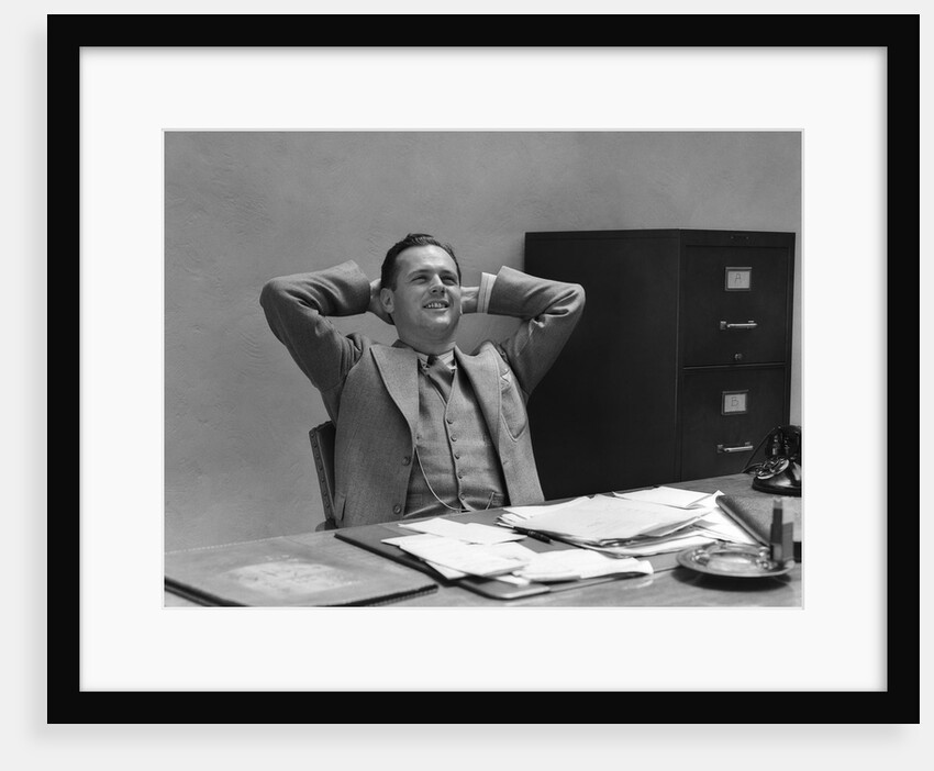 1930s 1940s Man Businessman Relaxing At Desk In Office by Anonymous