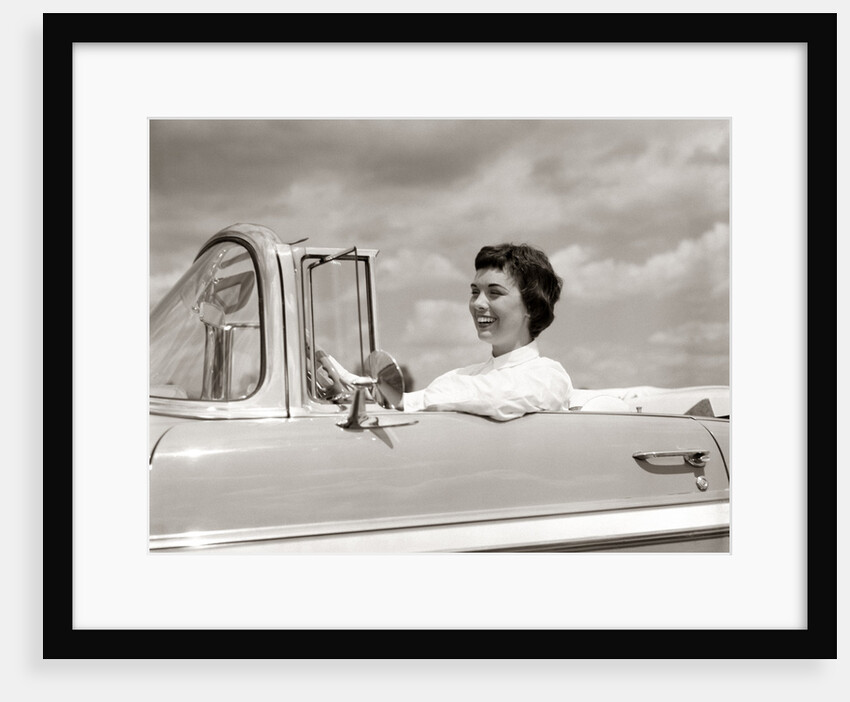1950s Woman Driving Chevrolet Convertible Automobile by Anonymous