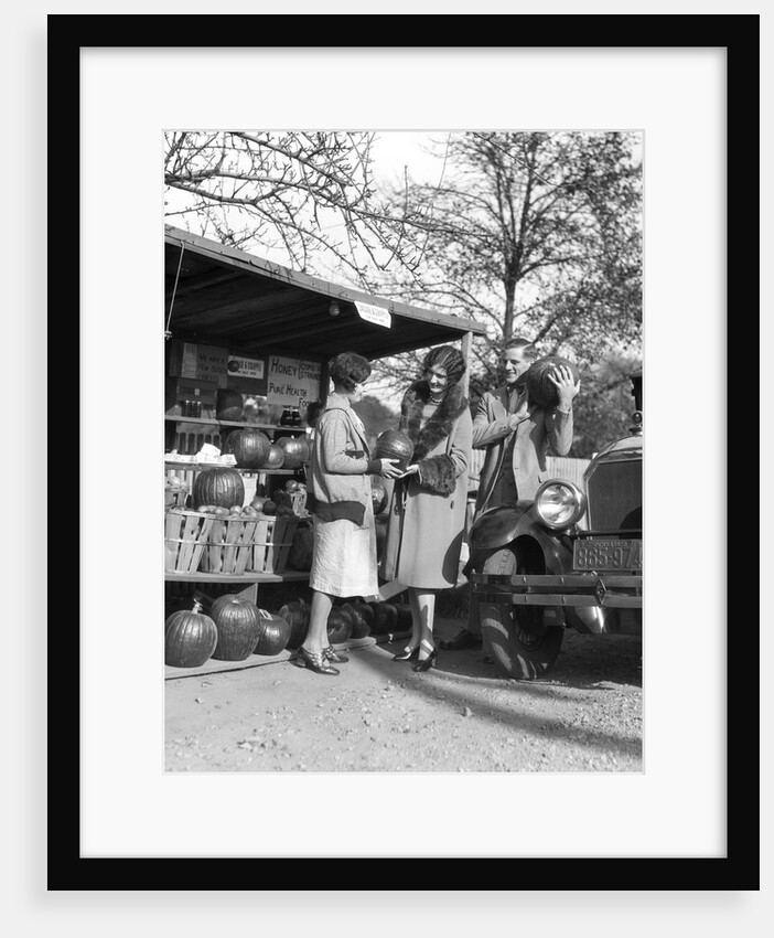 1920s Couple Women Man At Roadside Produce Stand Buying Pumpkins by Anonymous