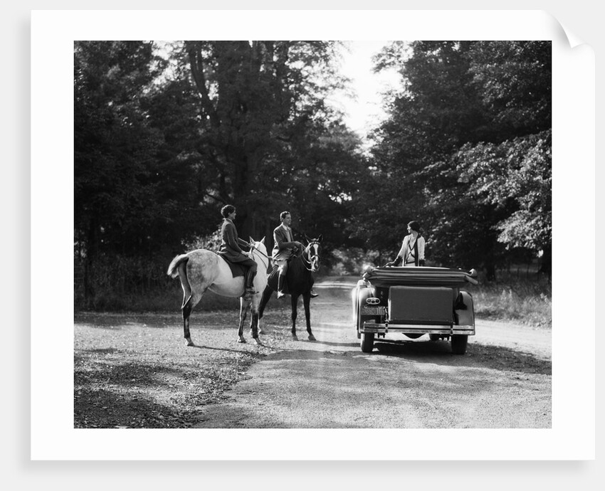 1920s 1930s Couple On Horses Meeting Woman On Road In Convertible Touring Car by Anonymous