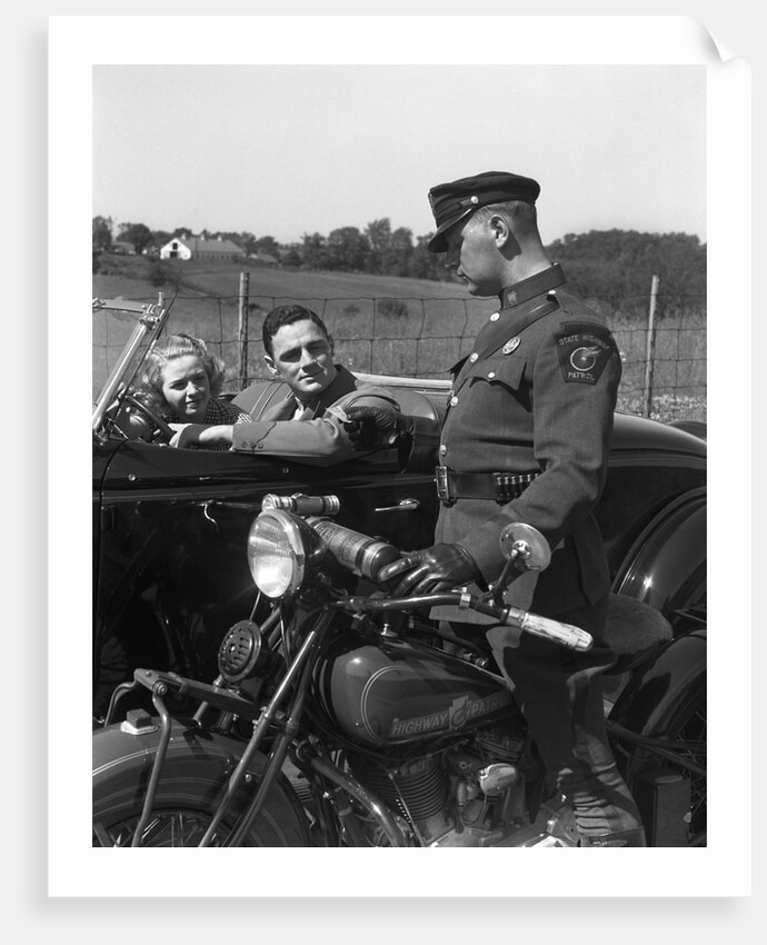 1930s Couple In Convertible Coupe Stopped By Motorcycle Cop Checking License Of Driver by Anonymous