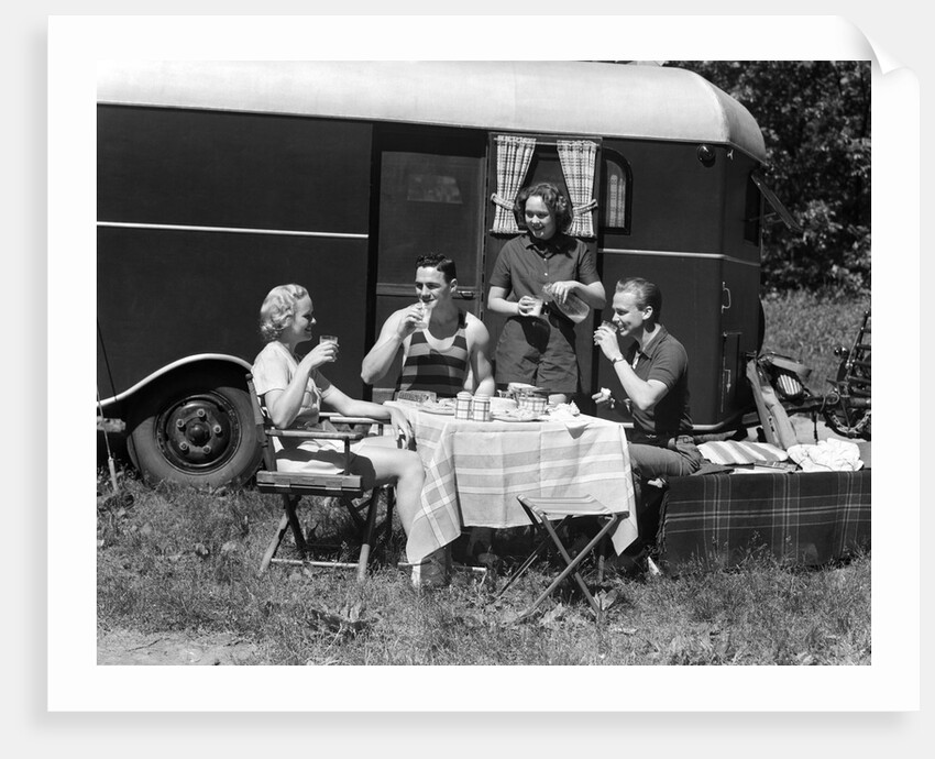 1930s Two Couples Eating Picnic Lunch Beside Camping Trailer by Anonymous