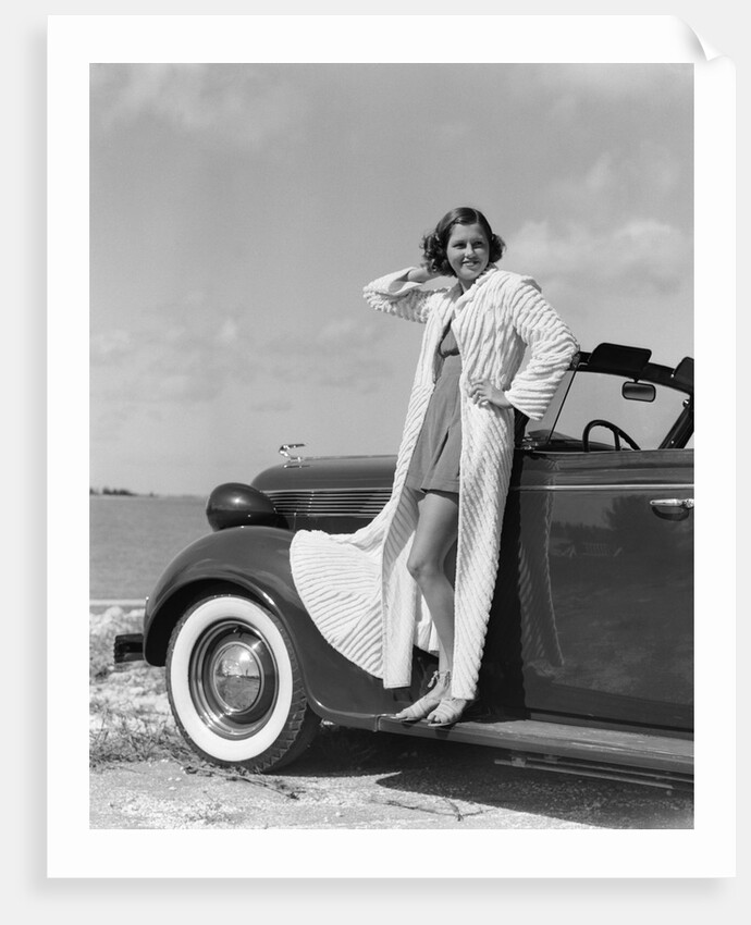 1930s 1940s Woman Wearing Chenille Beach Robe Posing On Running Board Of Convertible Roadster Automobile by Anonymous