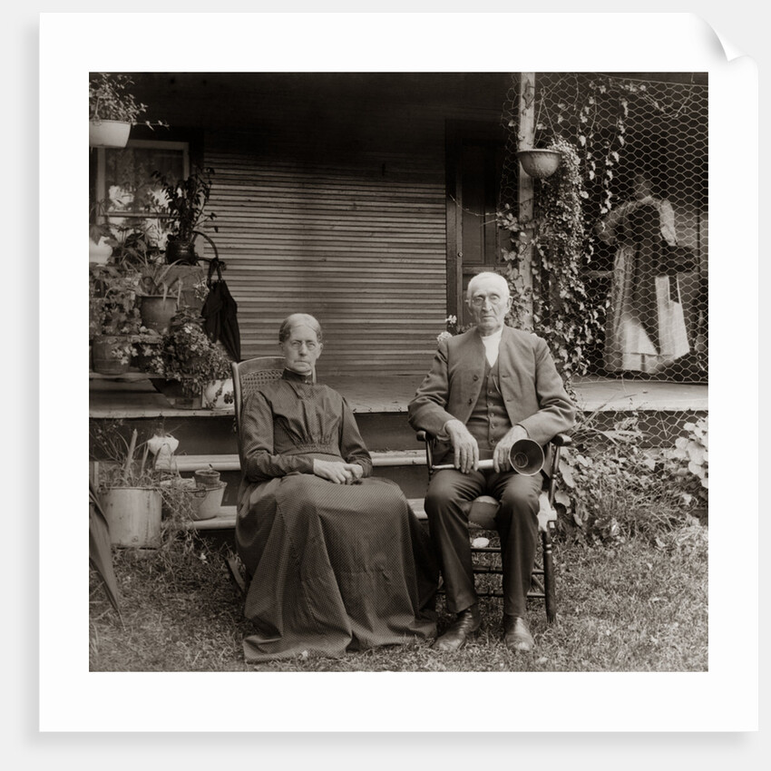 1890s 1900s Portrait Senior Couple Seated In Garden Man Holding Ear Trumpet by Anonymous