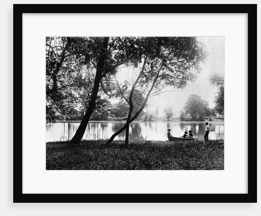 1890s 1900 Older Brother Watching Three Younger Children In Rowboat On Small Lake by Anonymous