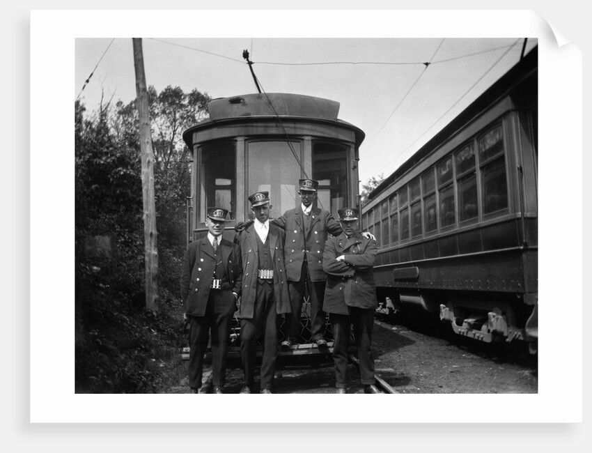 1900s Conductors Posing In Front Of Trolley Car by Anonymous