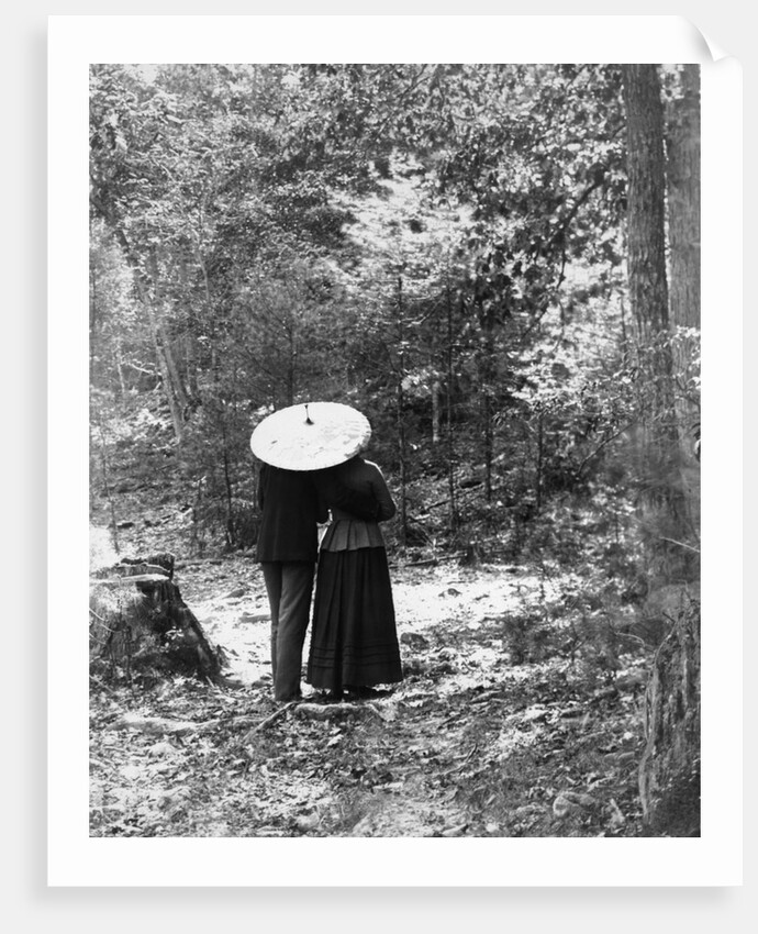 1900 View Of Back Of Couple Walking Through Woods Under Umbrella Man With Arm Around Woman by Anonymous