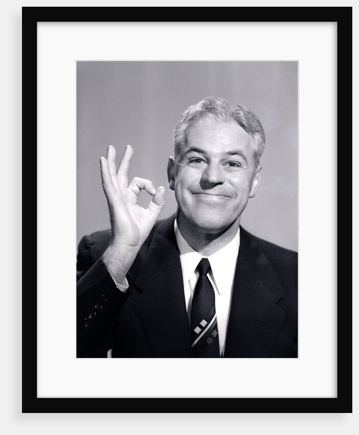1950s Portrait Of Happy Man Businessman Slesman Making An Ok Hand Sign by Anonymous