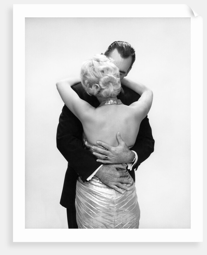 1950s 1960s Wife In Backless Satin Gown Evening Dress And Husband Embracing And Kissing by Anonymous