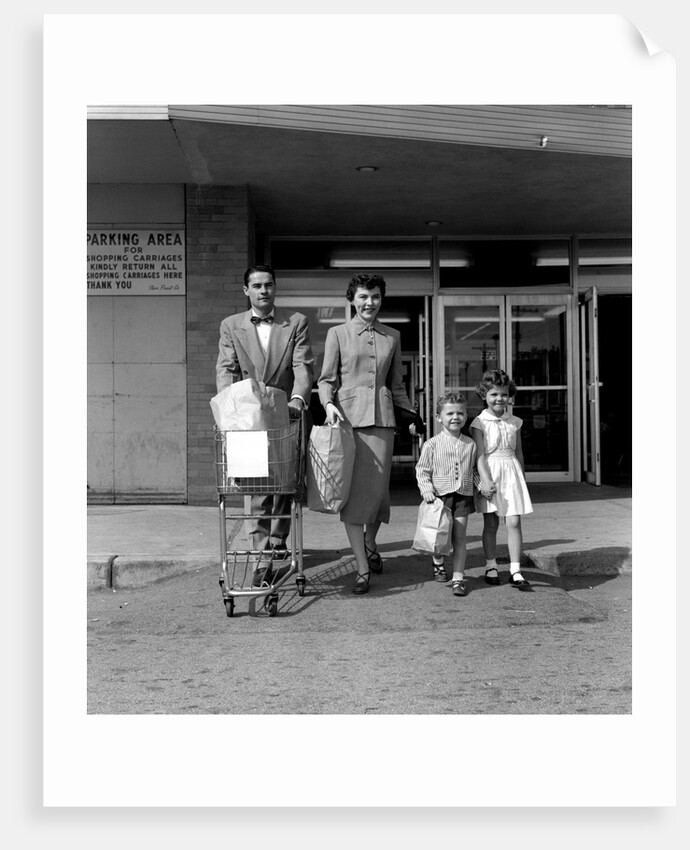 1950s Family Walking Out Of Supermarket Store by Anonymous