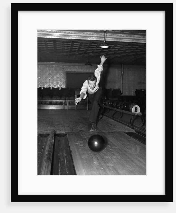 1930s Man Bowling Just Releasing Ball Into Alley by Anonymous