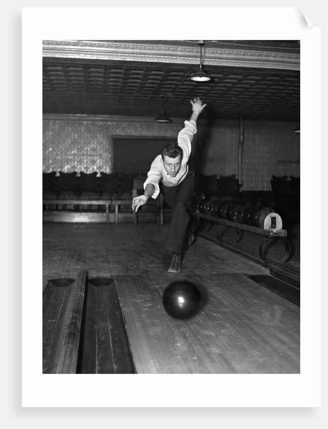 1930s Man Bowling Just Releasing Ball Into Alley by Anonymous