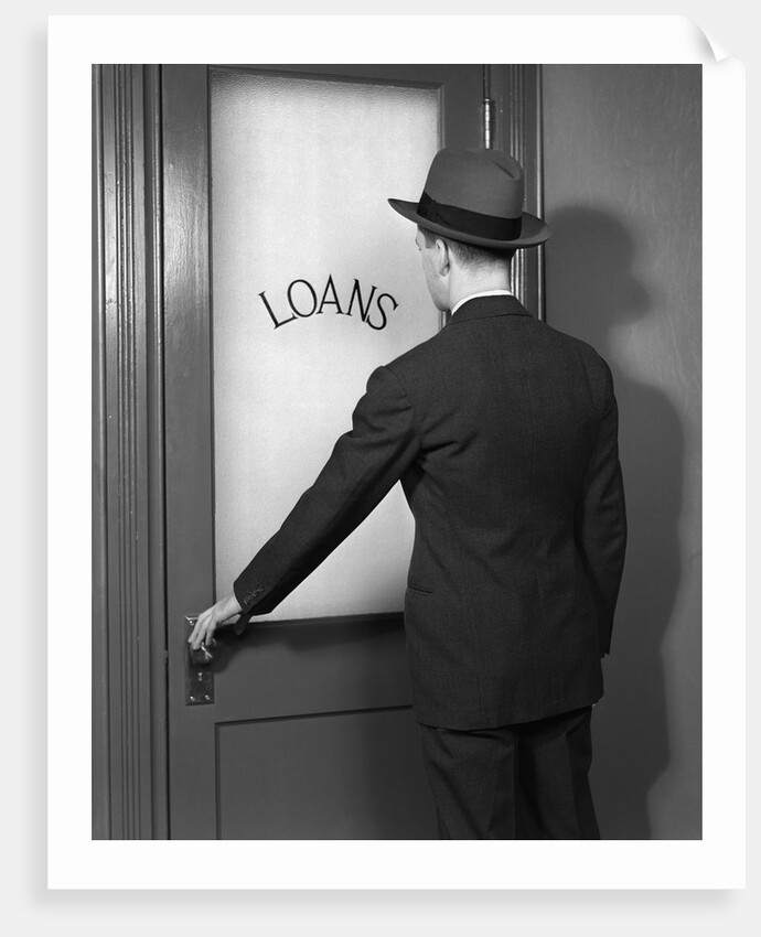 1930s 1940s Man In Suit And Hat Opening Door Marked Loans by Anonymous
