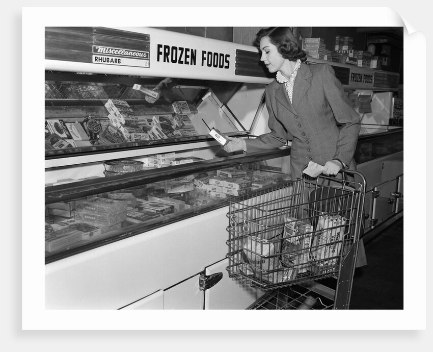 1950s Woman Shopping Frozen Food Section Of Grocery Store by Anonymous